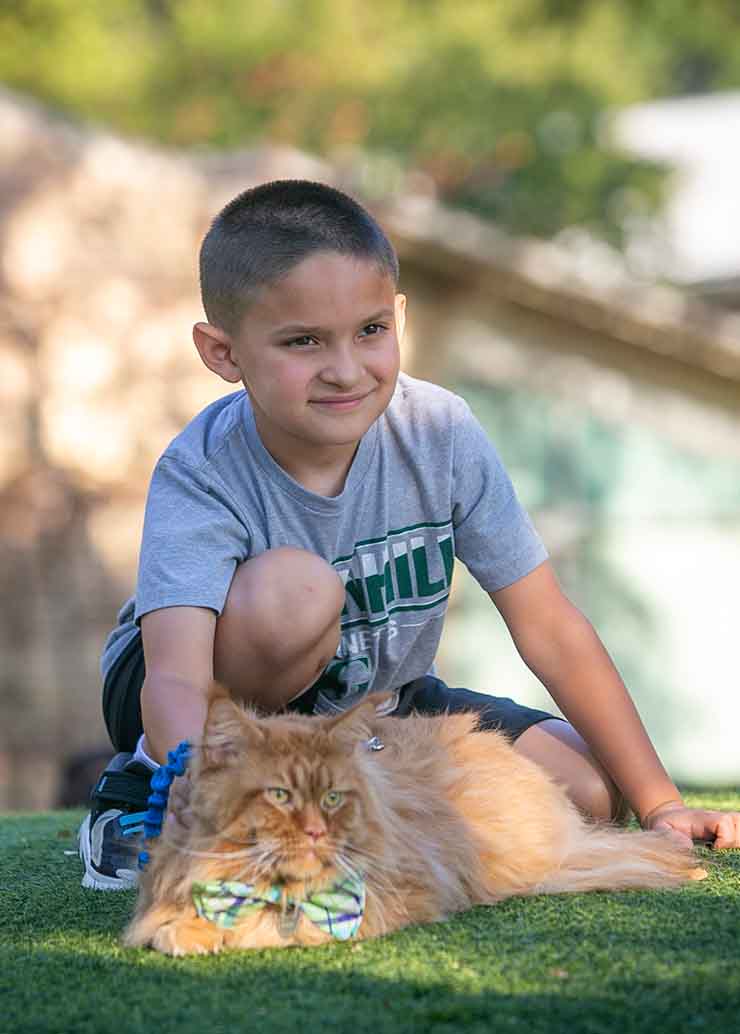 Student with his pet cat